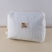 Trousse en nid d'abeille, trousse de toilette publicidad
